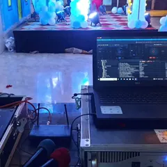 A view from my DJ station during a birthday party. I use professional DJ software on my laptop, connected to my controller and wireless microphone system, giving me full control over the music and announcements.