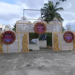An elegant venue entrance with large gates decorated with floral wreaths. This sets a festive tone right from the moment guests arrive.