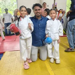 Two of our young girl champions showing off their medals after a tough competition. We train them to be strong, confident, and ready for any challenge.