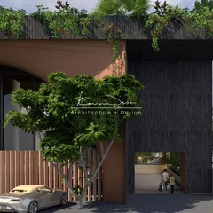 A closer look at how materials and nature work together. The rough texture of the dark facade is a bold choice, balanced by the organic feel of the overhanging rooftop garden and the warmth of the wood-paneled fence.