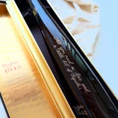 "All you need is love and a little bit of Tequila." A fun and stylish quote engraved on a Don Julio 1942 bottle, showcasing how personalization can add character and wit to a gift.