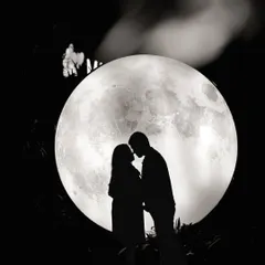 A classic silhouette against our giant moon prop. This setup is perfect for creating timeless and artistic black and white couple portraits.