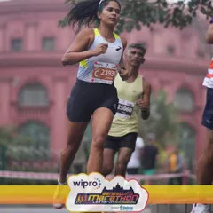 Mid-race focus during the Bengaluru Half Marathon. Performance isn't just about physical strength; it's about mental toughness. I coach my athletes to build resilience so they can push through the tough moments and execute their race plan.