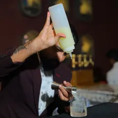Precision in every pour. This action shot from the bar at That Place Kolkata shows the importance of accurate measurements for drink consistency, a key part of my staff training.