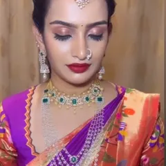 With eyes closed, you can see the soft, shimmery eyeshadow work. This is a versatile reception look that photographs beautifully.