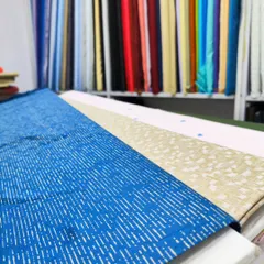 A selection of premium fabrics available in my studio for custom-made shirts and kurtas, showing a variety of prints and weaves for you to choose from.