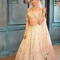 When less is truly more. This full-length shot showcases a breathtaking ivory lehenga, with glam makeup that enhances natural beauty for an effortlessly radiant bridal look.