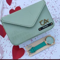 The personalized sling bag and watch combo, featured here in a lovely sea green. The bag can be customized with a name and a charm of your choice.