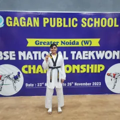 Proudly displaying the gold medal from the CBSE National Taekwondo Championship. This level of achievement is the result of relentless training and dedication.