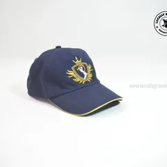 This navy blue cap with intricate gold embroidery is a perfect example of our premium headwear. The detailed logo and contrasting yellow trim create a high-end look for any brand.