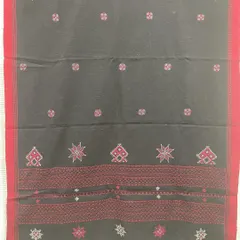This black woollen shawl features a striking red border and motifs from Kasuti and Negi embroidery traditions. It's a bold and beautiful piece to keep you warm.
