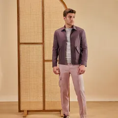 Move beyond the basics with elevated hues for the season. This look pairs a deep maroon shacket with muted pink trousers, showcasing a confident use of color in contemporary menswear.
