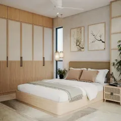 We love working with natural materials to create a calming atmosphere. This bedroom features a Japandi-inspired design with a light wood and cane bed, matching wardrobe, and minimalist artwork.