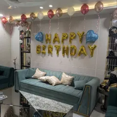 This angle shows the reflection of the balloons in the coffee table, adding to the festive feel of the room.