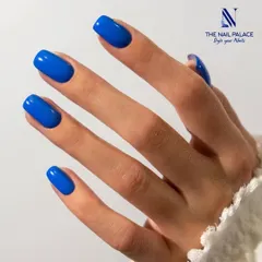 A crisp, clean shot of a classic square-shaped manicure in a vibrant cobalt blue. This timeless look is perfect for any occasion and showcases a flawless gel polish application.