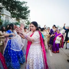 The mother of the groom showing off her moves as the baraat arrives.