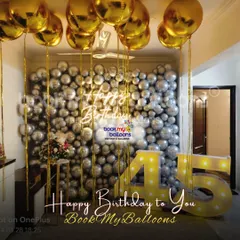 We help you celebrate major company or personal milestones. For this 45th anniversary, we constructed a full wall of silver and chrome balloons, accented with floating gold helium balloons and large, illuminated marquee numbers to mark the occasion.