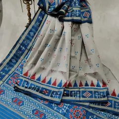 A Sambalpuri Ikkat cotton saree from Odisha. The combination of white, blue, and red, along with the temple border, is characteristic of this beautiful regional weave.