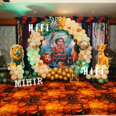 A closer look at our detailed Jungle Book and Lion King themed birthday decor. The setup features a custom backdrop with the birthday boy's photo, balloon arch, and character cutouts for a picture-perfect celebration.