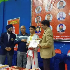 Our student Shiva receiving his gold medal at the state karate championship, earning his selection for the nationals.