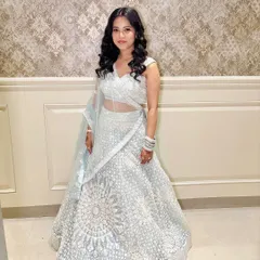A full-length shot of the client in her elegant lehenga.