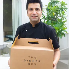 We are proud to partner with global food icon Chef Kunal Kapur. Here he is with our signature Dinner Box, ready to deliver his curated '7 Gulabi Bagh' menu.