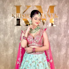 A beautiful pose showing off the intricate details of the mint green bilandi work necklace and matching earrings, perfect for a pre-wedding event.
