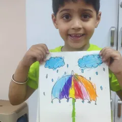 This colorful umbrella in the rain is a perfect example of imaginative drawing. The student has done a wonderful job blending colors to create a rainbow effect.