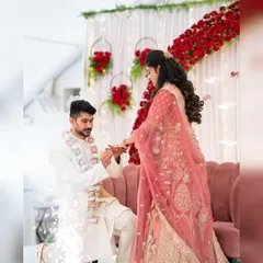 This is a moment that deserves the perfect setting. For this engagement, we created a romantic backdrop with a dense wall of red roses, elegant white drapes, and hanging floral hoops, complete with cold pyro effects for that extra sparkle.