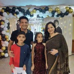 A lovely family photo taken at a birthday party we organized. Our goal is to create a stress-free environment where families can relax and enjoy these precious moments together.