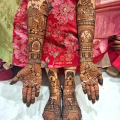 A complete bridal look is essential. Here you can see how I coordinate intricate designs for both the hands and feet, featuring traditional elephant motifs and detailed patterns that extend up the arms and legs.