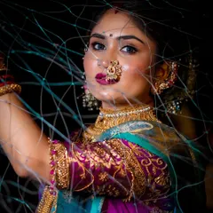 This creative shot for Narali Purnima captures the essence of the Koli tradition. The makeup features a bold lip and defined eyes, creating a striking look that honors the festival of the sea.