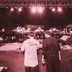 The view from behind the decks, looking out at a sea of people at a music festival. There's no feeling like controlling the energy of a crowd this size.