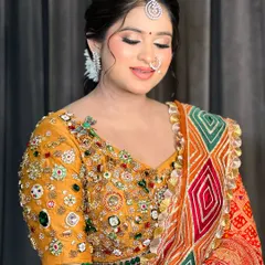 A close-up of the bride's makeup, with her eyes closed to show the soft, shimmery eyeshadow.