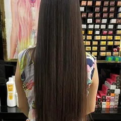 A client showing off her hair after a Botox treatment, which starts at just 1199 rupees. It's a great way to get healthy, shiny hair.