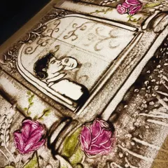 A work in progress for a beautiful song, this piece captures a romantic moment. The use of coloured sand for the flowers adds a touch of softness and beauty.