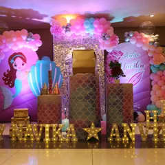 A full view of the mermaid-themed birthday party we designed. The combination of the sequin wall, custom printed backdrops, and marquee letters creates a stunning focal point for the celebration.