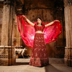 A bridal portrait at a historic stepwell, with a monkey photobombing in the background. These unexpected moments add character to destination shoots.