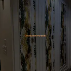 This wardrobe features custom wallpaper panels framed with molding, turning a simple storage unit into a piece of art.
