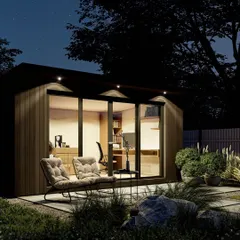 Our modular prefab rooms can be designed as quiet, standalone home offices or studios. This night view highlights the warm, inviting interior and efficient use of space, showing how a compact structure can become a functional and stylish extension of your home.