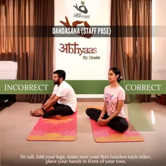 This image shows the proper way to sit in Dandasana (Staff Pose). A straight spine is the foundation for many seated postures, and we focus on getting this right from day one.