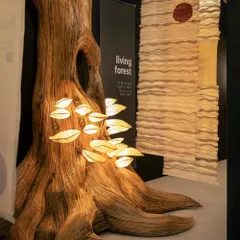 A detailed shot of the 'Living Forest' tree installation. The texture of the trunk and the soft light from the mushroom lamps created a focal point that was both interactive and educational. We explained how the material, Lantana, is an invasive weed, making the installation a story of ecological redemption.