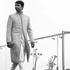 A portrait of my groom, Pratyush, looking sharp and confident on his wedding day. We chose a classic, intricately embroidered sherwani from Tarun Tahiliani that was both regal and personal.