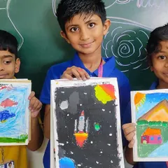 Students proudly display their colorful artwork from our school-wide arts and crafts activity. We encourage creative expression through various mediums, from drawing and painting to origami.