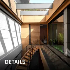 Details are everything. This image shows a wooden staircase with a glass railing, set against a board-formed concrete wall. The skylight above casts shifting patterns of light and shadow, bringing the static architecture to life throughout the day.
