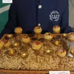 We love getting creative with our presentation. Here, we've served a tasty chana preparation in individual stands, making it easy for guests to enjoy this flavorful bite-sized snack.