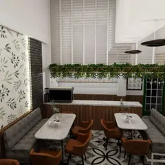 This view showcases the feature wall with a botanical wallpaper, which acts as a focal point and adds a fresh, organic feel to the cafe. The layout ensures a clear path to the service counter, which is framed by hanging greenery.