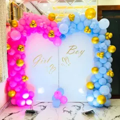 Building excitement for a gender reveal party with this "Girl or Boy?" backdrop. We use distinct pink and blue balloon arches that meet at the center, accented with gold balloons for a touch of elegance, creating the perfect photo opportunity for the big announcement.