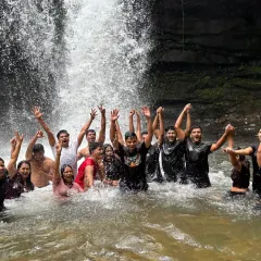 It’s not just about the climb, it’s about the celebration. Here’s one of my groups cooling off and having a blast in a natural waterfall pool during a monsoon trek. I make sure my trips are packed with these moments of pure fun.