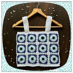 A closer look at my popular evil eye granny square top. Each square is carefully crocheted and joined to create this unique protective pattern. It's a fun, modern take on a classic crochet style.